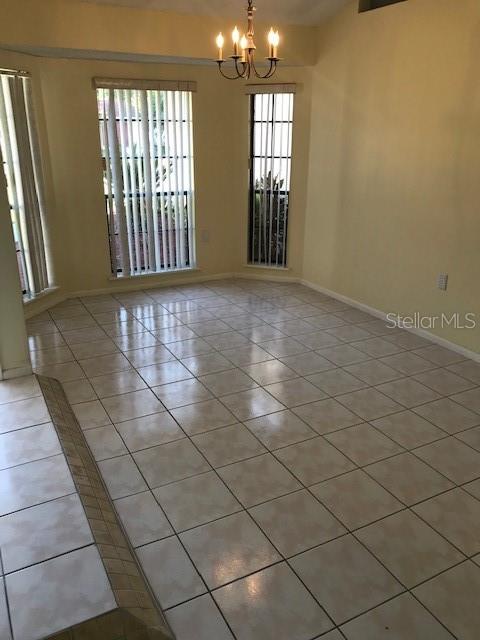 715 Caribou Drive Kissimmee, FL 34759 - Photo 2 of 13 a view of an empty room and window
