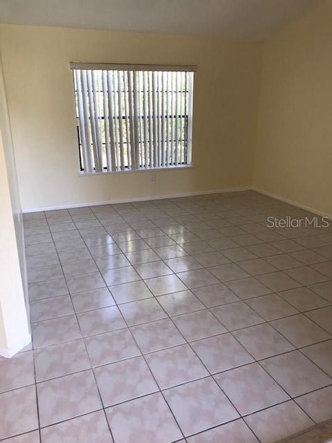 715 Caribou Drive Kissimmee, FL 34759 - Photo 3 of 13 a view of an empty room and window