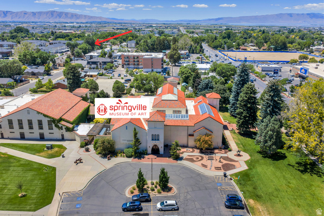 572 South 100 West, Unit E210 Springville, UT 84663 - Photo 31 of 35 Aerial perspective showcasing the Springville Museum of Art with its distinctive terracotta roof and surrounding landscape