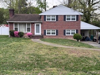 8306 Dade Road Richmond, VA 23227 - Photo 2 of 8 Split level home with a chimney, a front lawn, an