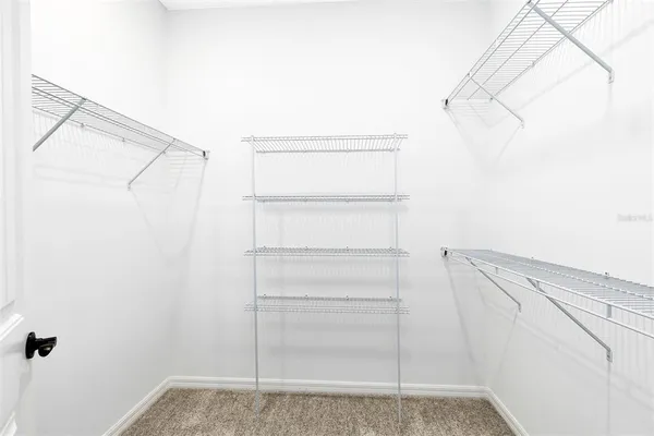 a room with a chair and furniture