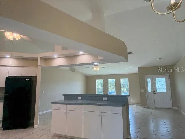 a bathroom with a granite countertop sink a shower and a mirror