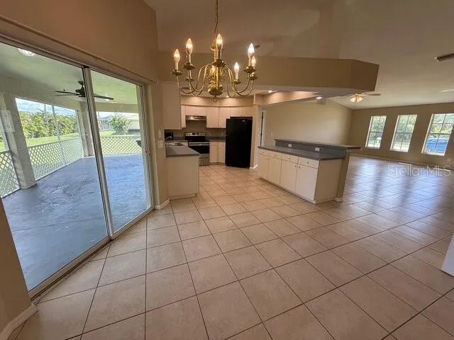 a kitchen with stainless steel appliances a refrigerator and microwave