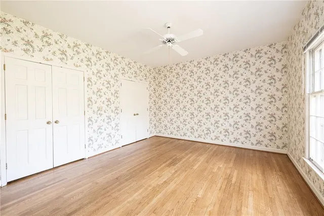 a view of a wooden floor with a large window
