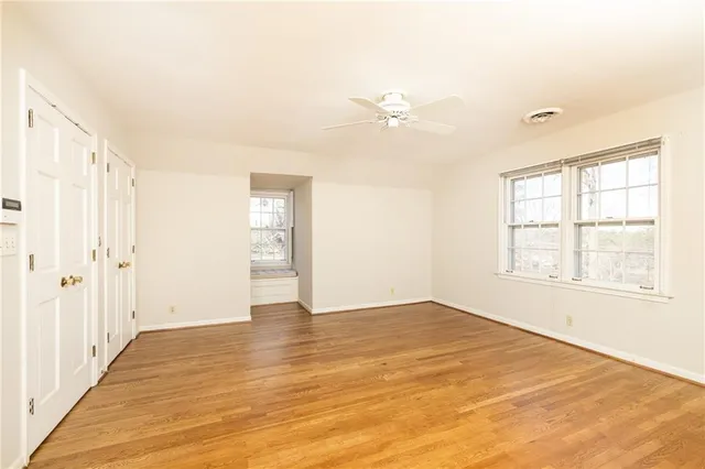 a view of an empty room with a window