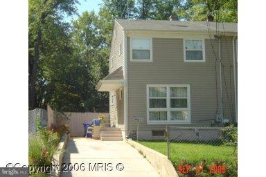 a view of house with yard