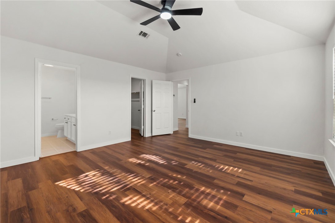 1751 Joy Spring New Braunfels, TX 78130 - Photo 24 of 35 a view of a livingroom with a hardwood floor and a ceiling fan