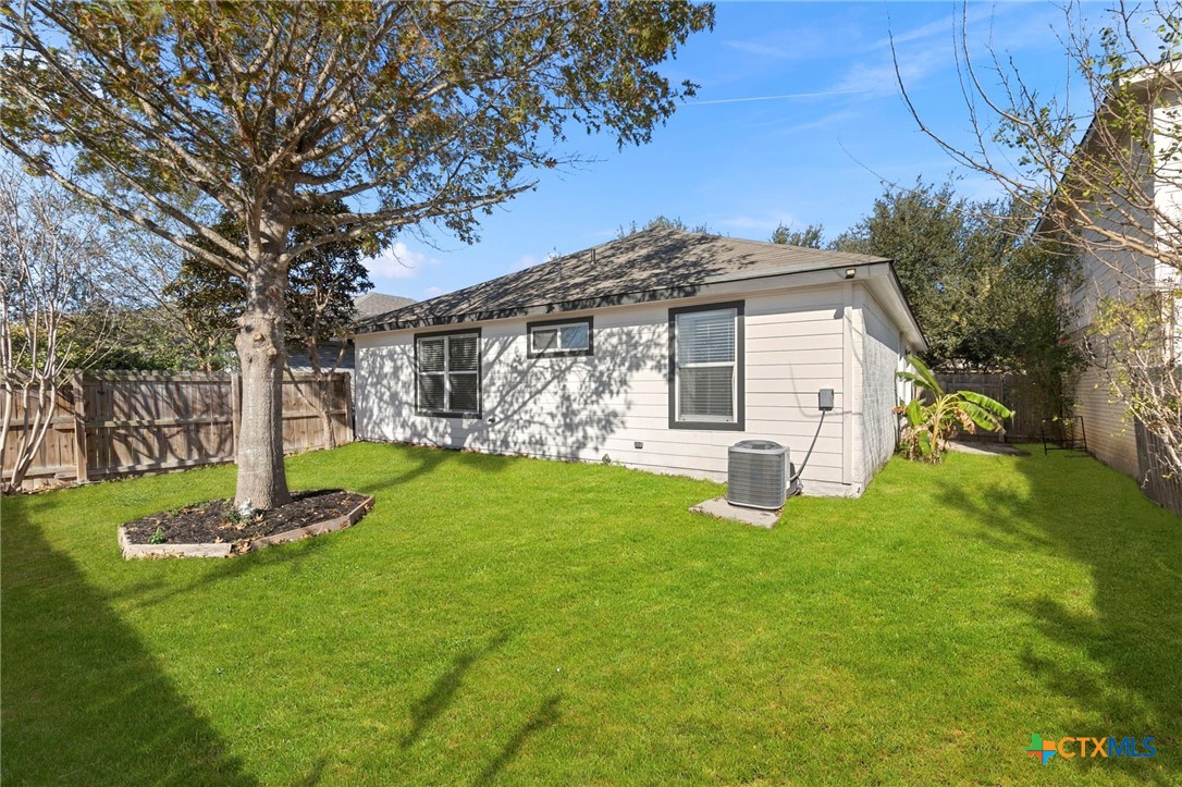 1751 Joy Spring New Braunfels, TX 78130 - Photo 27 of 35 a front view of a house with a yard