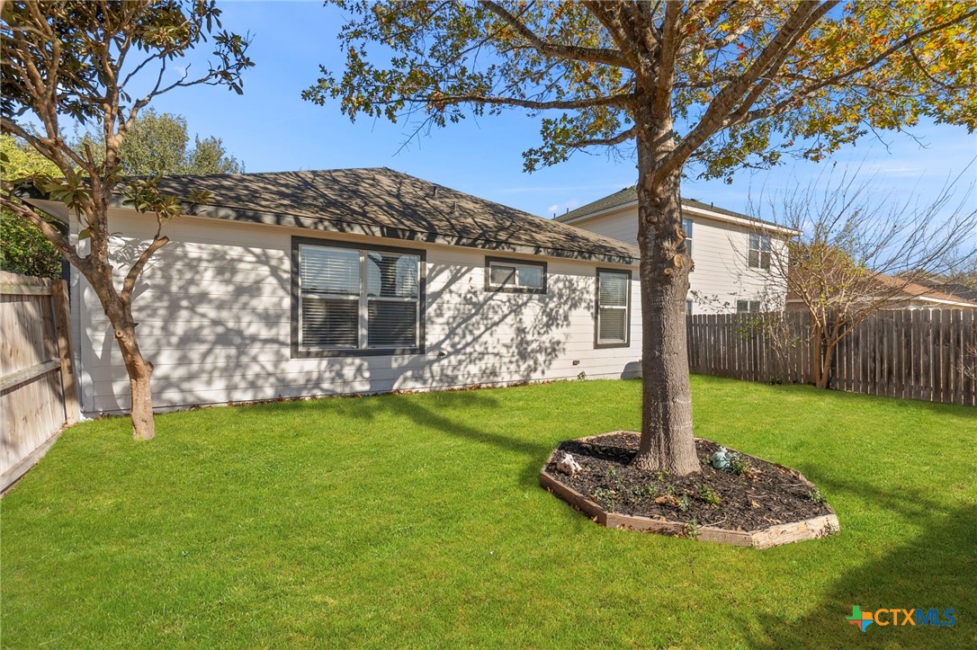 1751 Joy Spring New Braunfels, TX 78130 - Photo 28 of 35 a front view of a house with a yard