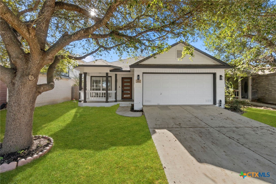 1751 Joy Spring New Braunfels, TX 78130 - Photo 3 of 35 a front view of a house with garden