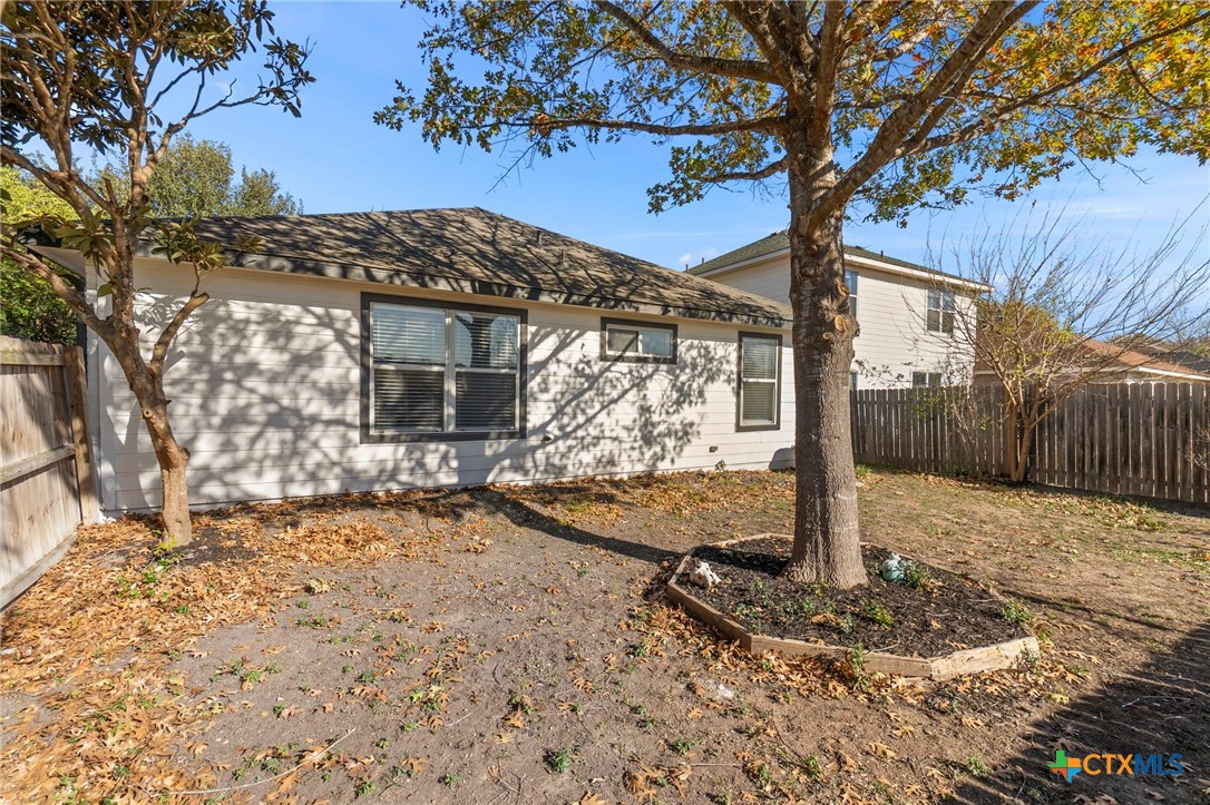 1751 Joy Spring New Braunfels, TX 78130 - Photo 31 of 35 a view of a house with a tree in the yard