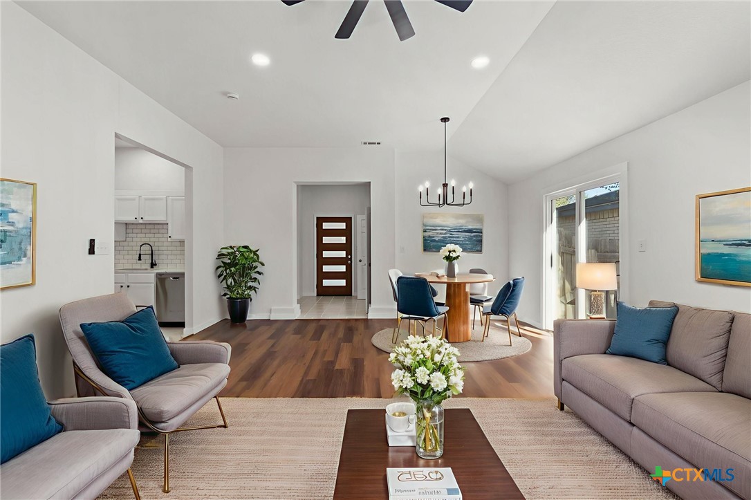 1751 Joy Spring New Braunfels, TX 78130 - Photo 7 of 35 a living room with furniture and a chandelier