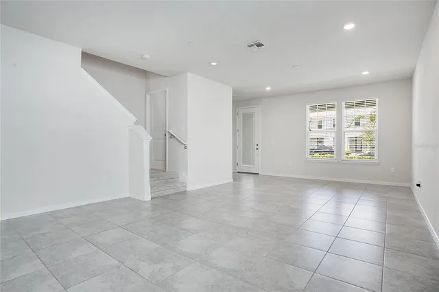 a view of an empty room with a window