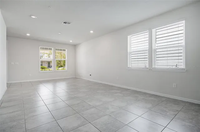 a kitchen with microwave a stove and cabinets