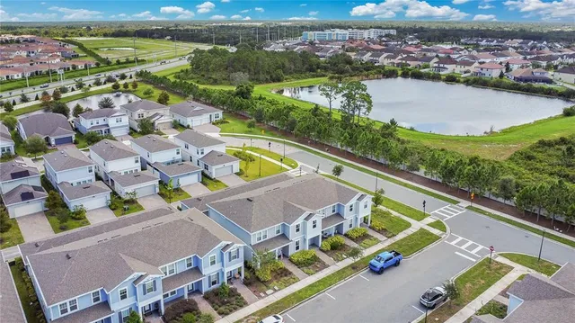an aerial view of a house with a lake view