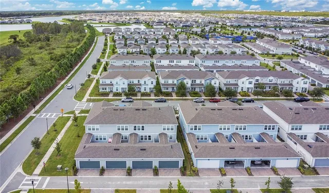 an aerial view of a city with lots of residential buildings
