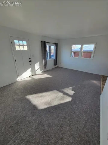 a view of empty room with windows