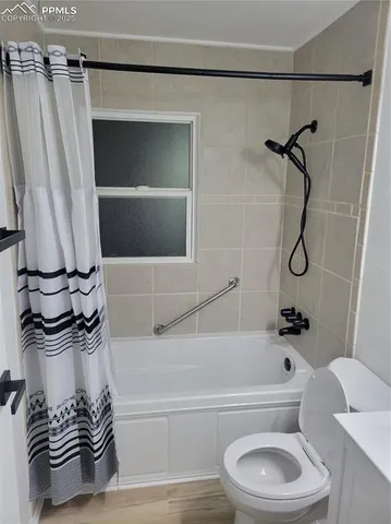 a bathroom with a sink a toilet and a bathtub