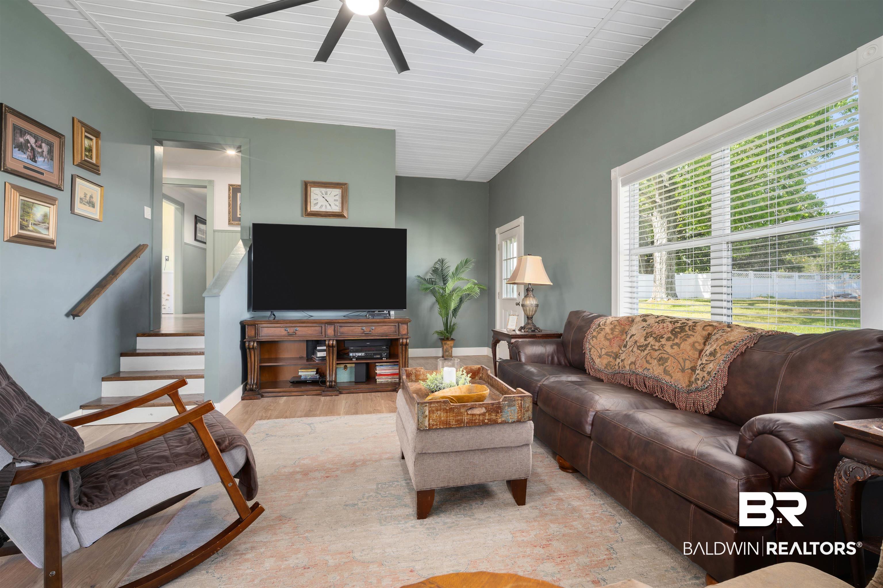 22 Horace Odom Road Millry, AL 36558 - Photo 13 of 39 Living room featuring light wood finished floors and a ceiling fan