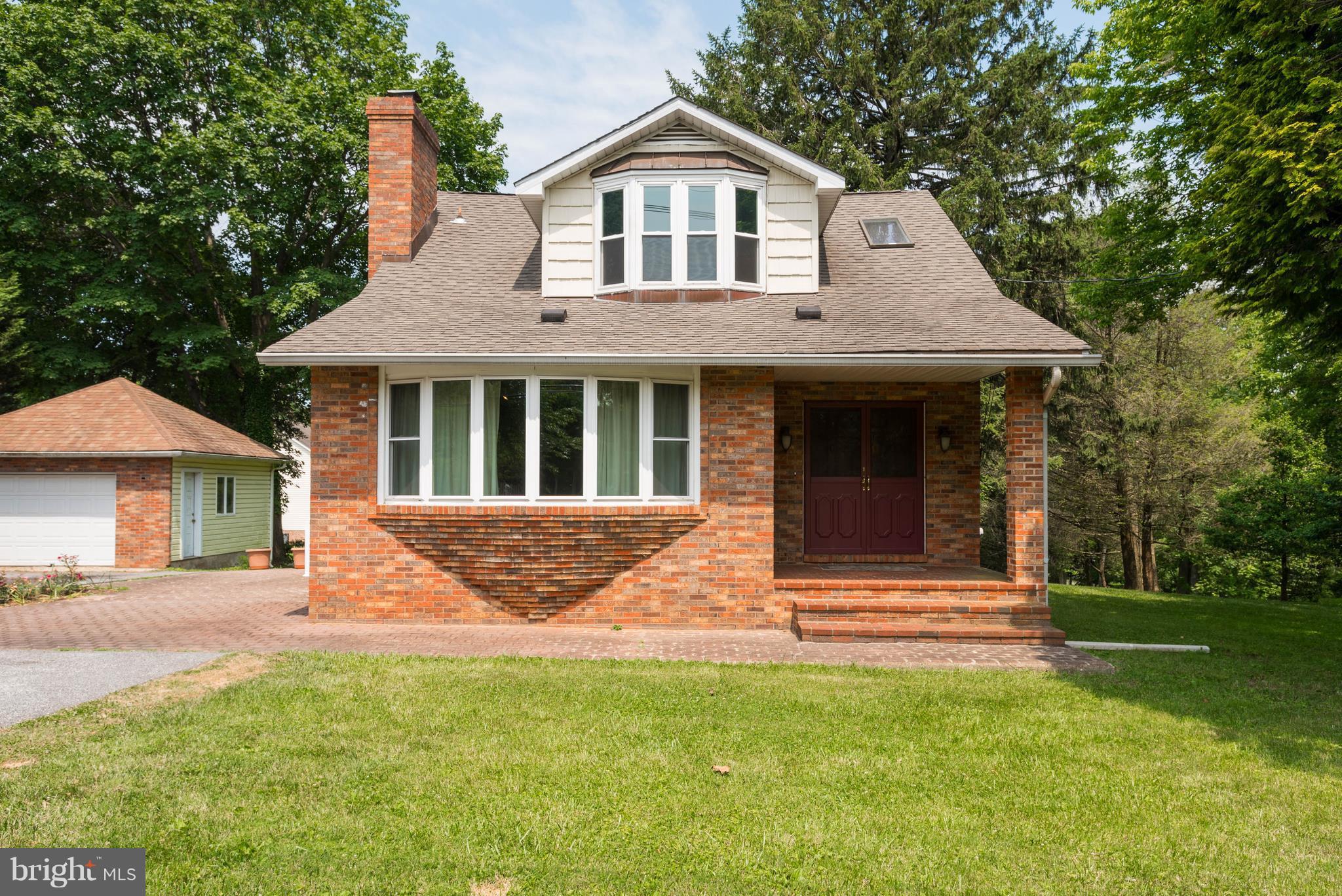 1404 Providence Road Baltimore, MD 21286 - Photo 1 of 26 a front view of a house with a yard
