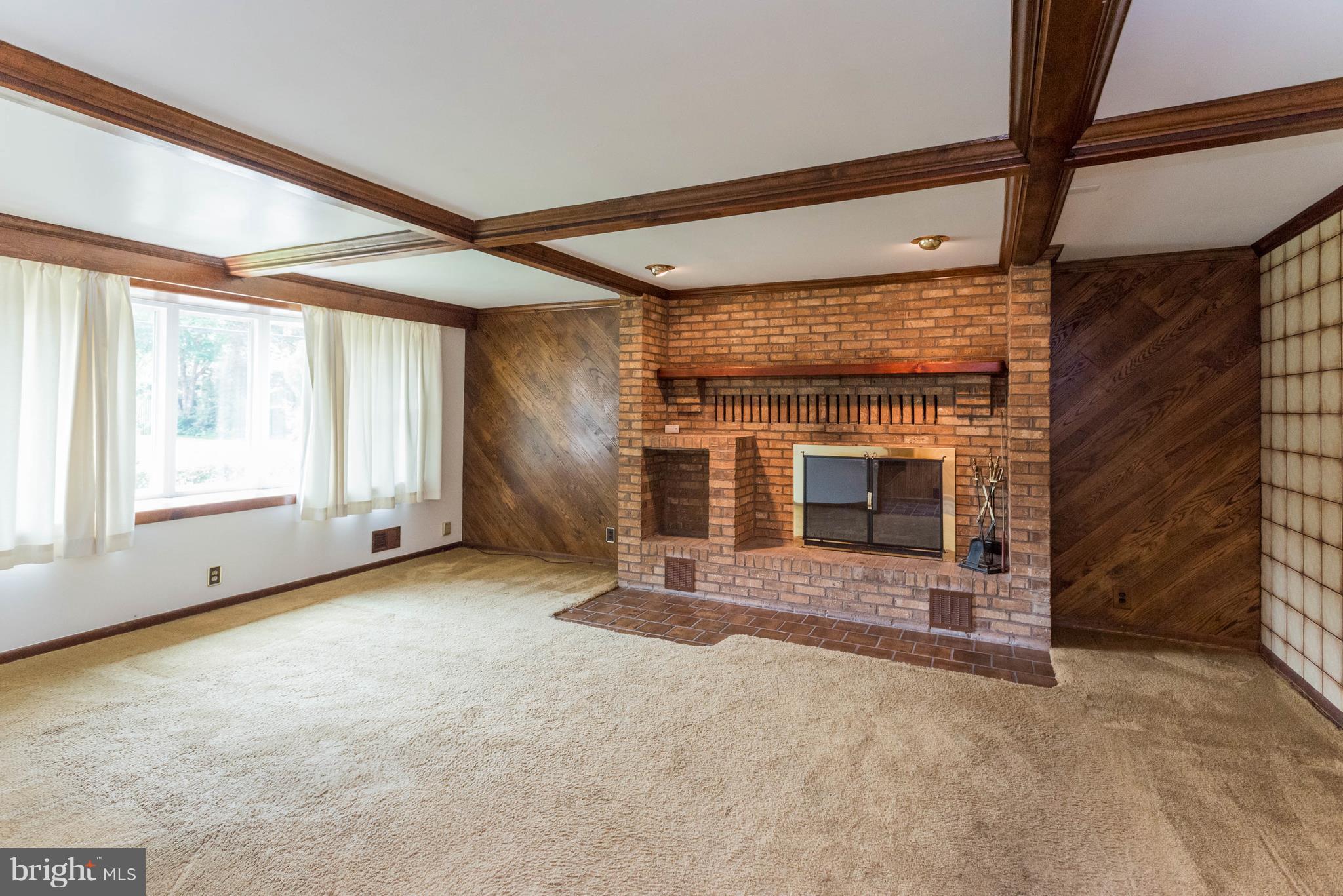 1404 Providence Road Baltimore, MD 21286 - Photo 5 of 26 a view of an empty room with a fireplace
