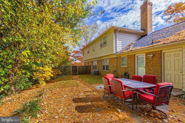 a backyard of a house with outdoor seating