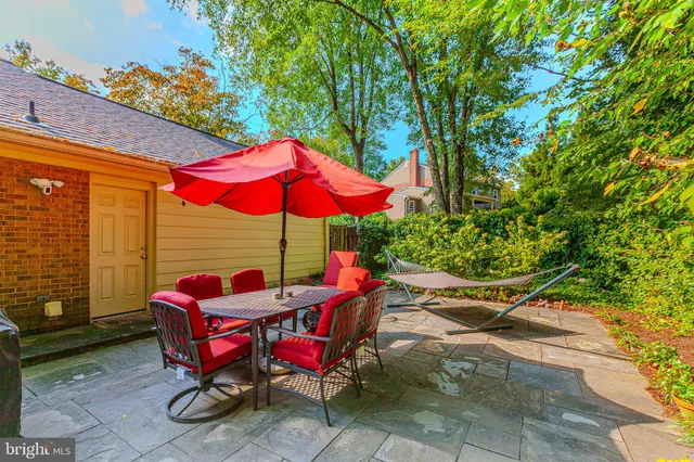 an outdoor space with furniture and umbrella