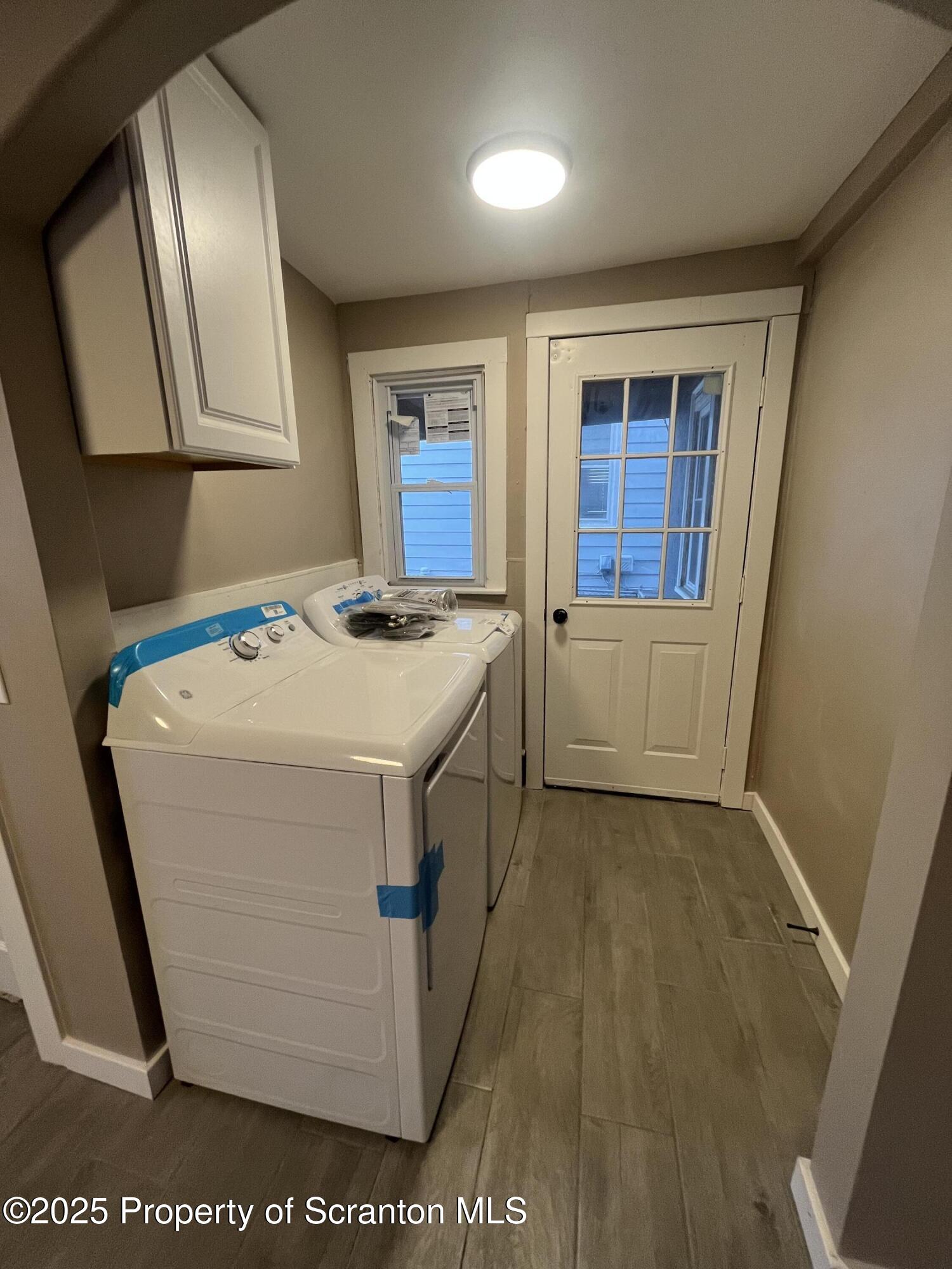 129 South Blakely Street, Unit 1 Dunmore, PA 18512 - Photo 2 of 6 a utility room with dryer and washer