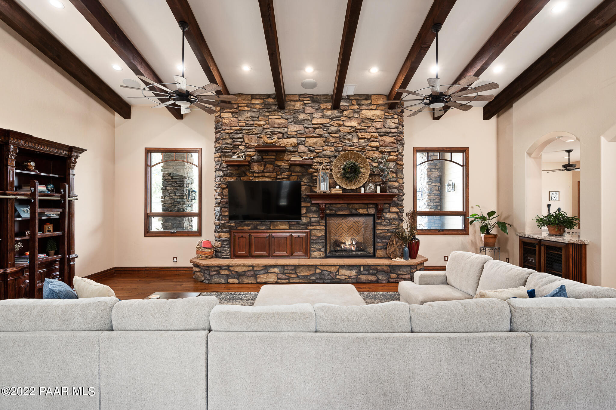5350 West Three Forks Road Prescott, AZ 86305 - Photo 16 of 90 a living room with furniture and a fireplace