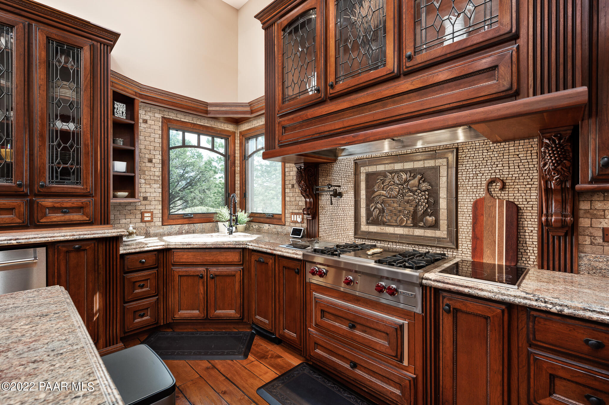 5350 West Three Forks Road Prescott, AZ 86305 - Photo 25 of 90 a kitchen with stainless steel appliances granite countertop a stove and a sink