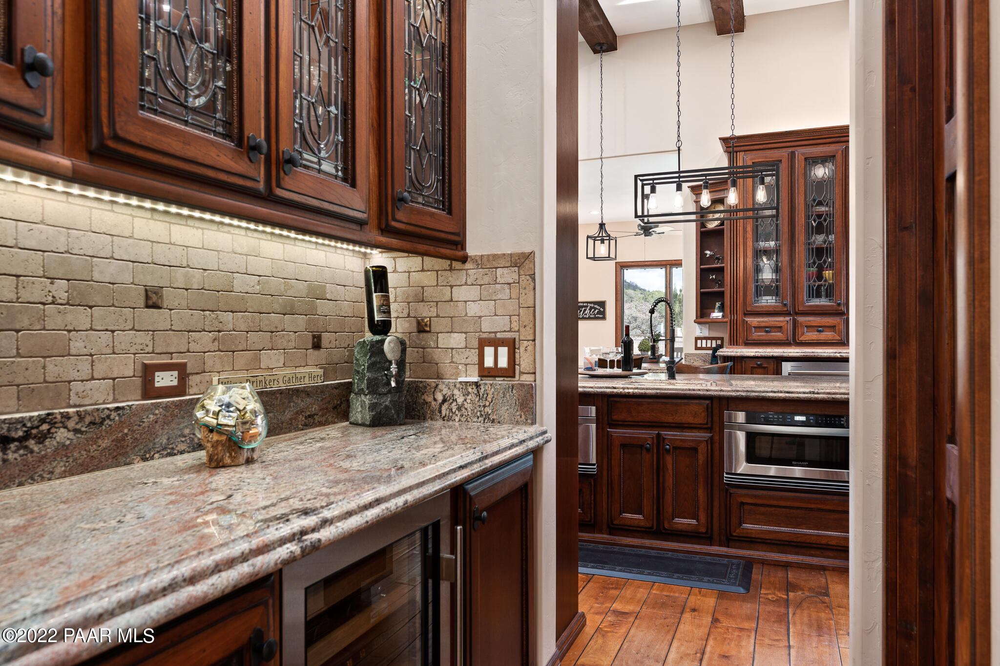 5350 West Three Forks Road Prescott, AZ 86305 - Photo 30 of 90 a kitchen with stainless steel appliances granite countertop a sink and cabinets