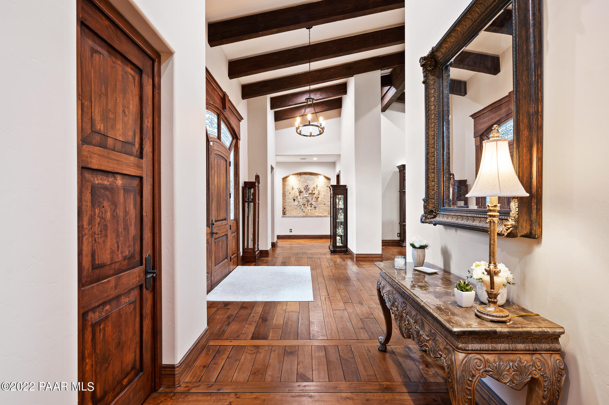 5350 West Three Forks Road Prescott, AZ 86305 - Photo 31 of 90 a living room with furniture a large window and potted plants
