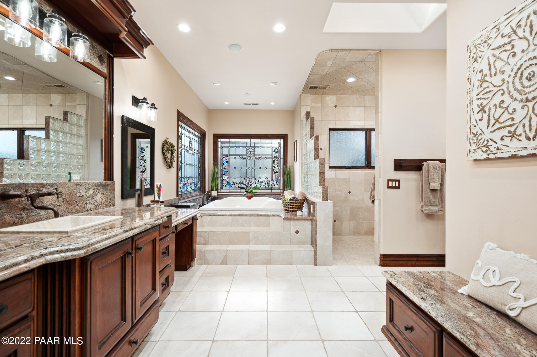 5350 West Three Forks Road Prescott, AZ 86305 - Photo 35 of 90 a large kitchen with stainless steel appliances granite countertop a large stove a sink dishwasher and a refrigerator with the cabinets