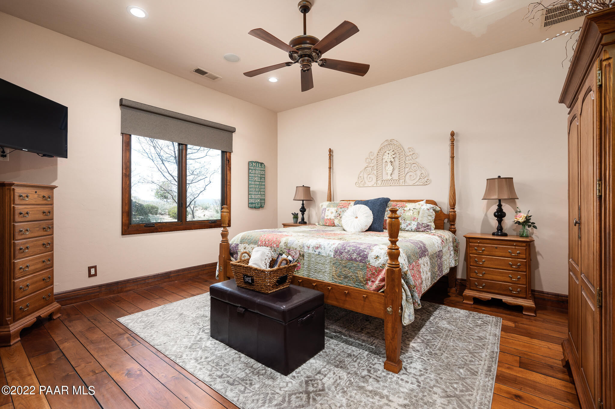 5350 West Three Forks Road Prescott, AZ 86305 - Photo 42 of 90 a bedroom with a bed and a flat screen tv