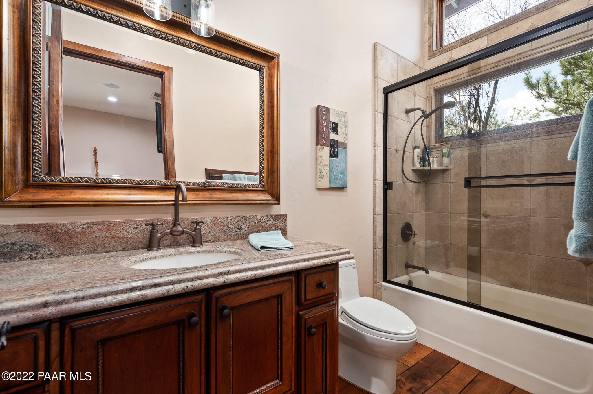 5350 West Three Forks Road Prescott, AZ 86305 - Photo 43 of 90 a bathroom with a granite countertop sink toilet and shower