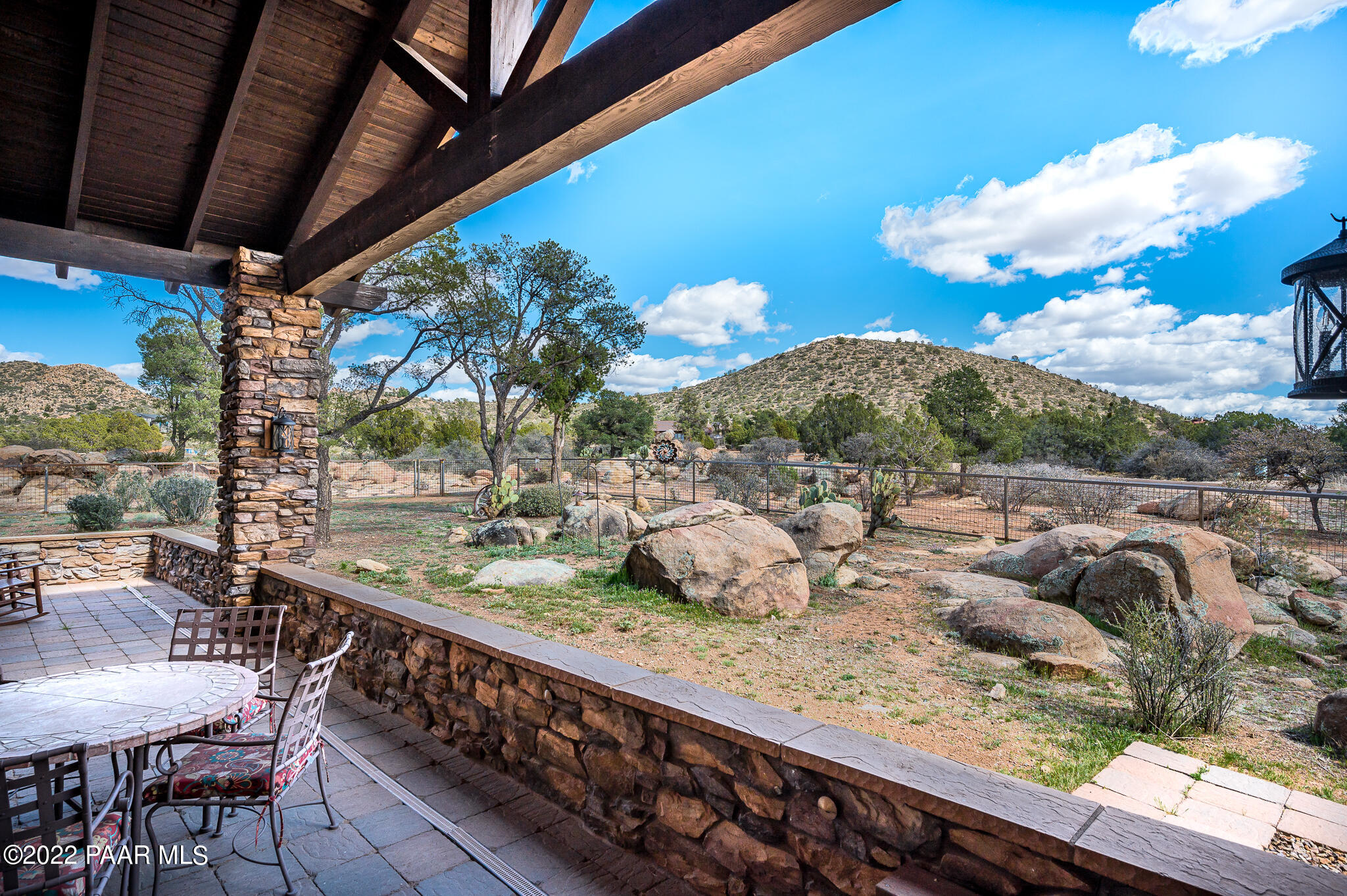 5350 West Three Forks Road Prescott, AZ 86305 - Photo 57 of 90 a view of a porch with furniture and a yard