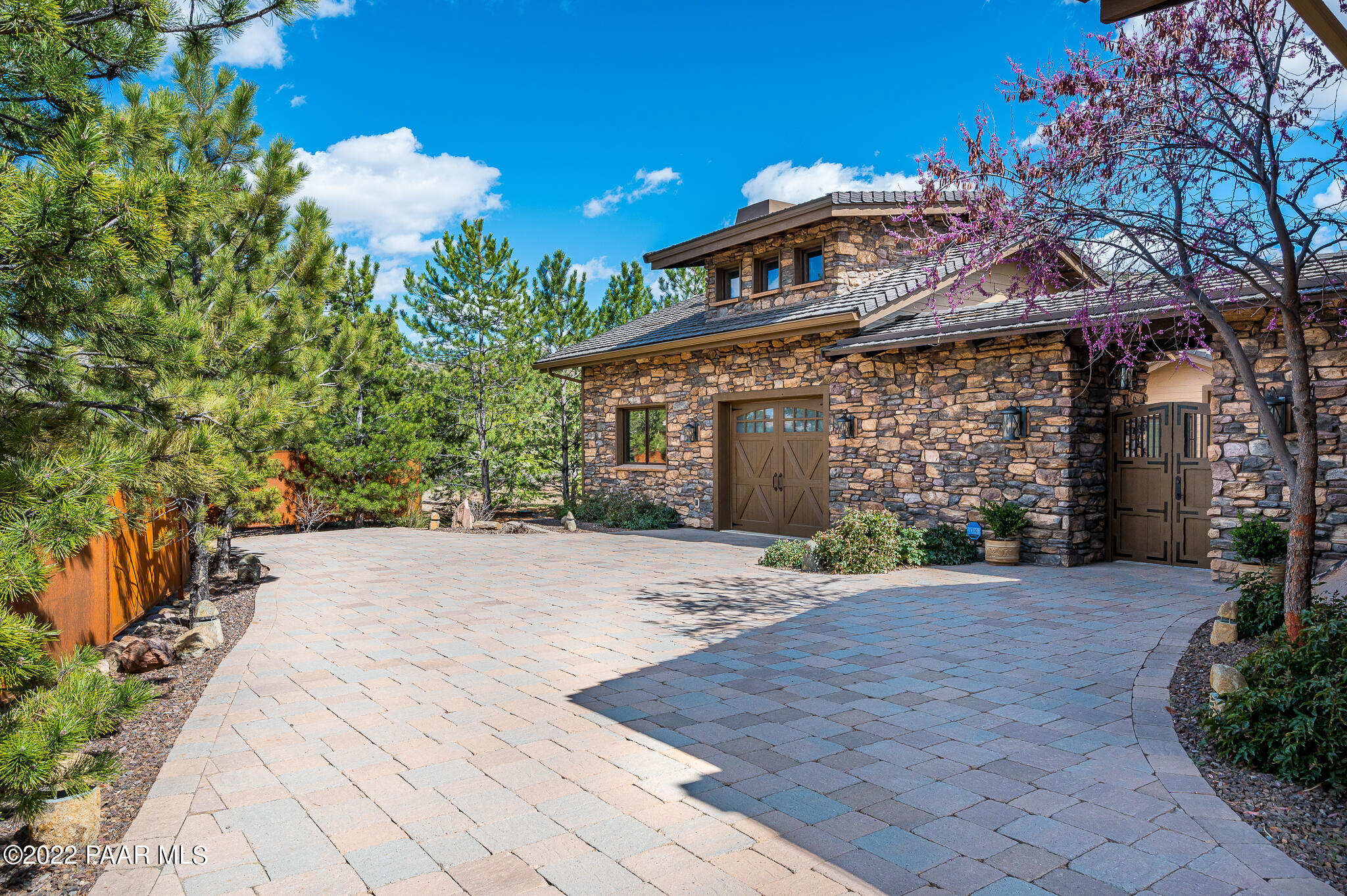 5350 West Three Forks Road Prescott, AZ 86305 - Photo 80 of 90 a front view of a house with a yard and a garage
