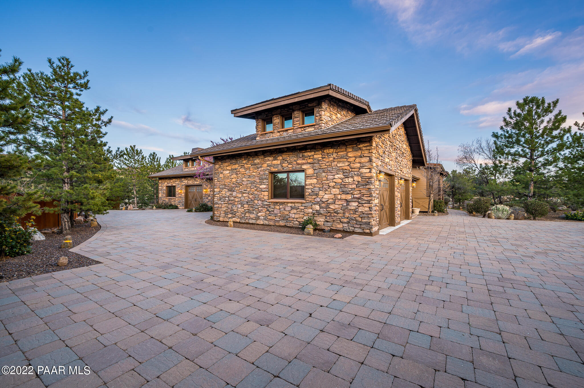 5350 West Three Forks Road Prescott, AZ 86305 - Photo 9 of 90 a front view of a house with a yard and garage