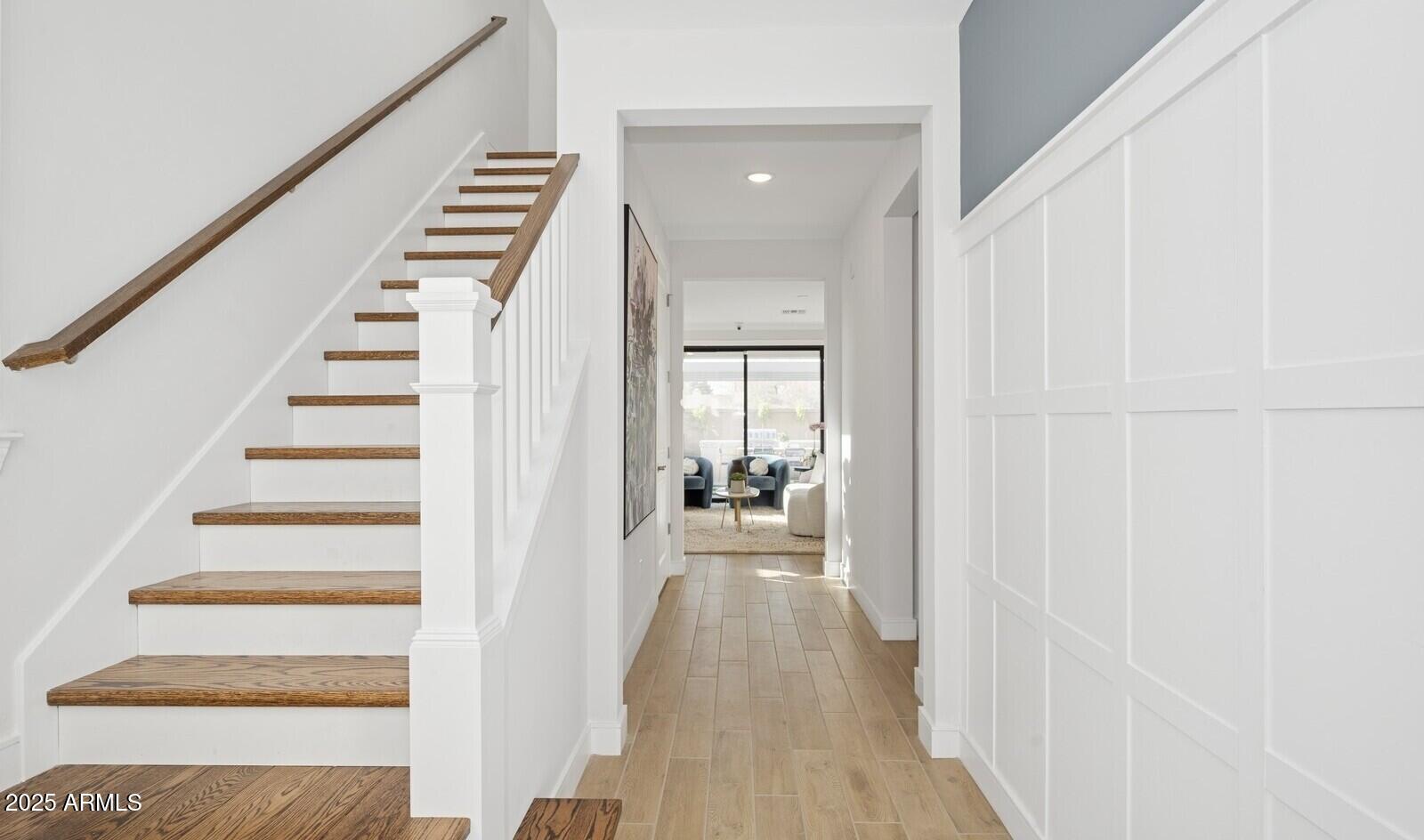 8046 West Royal Palm Road Peoria, AZ 85345 - Photo 15 of 31 a view of a hallway with wooden floor and staircase