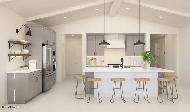a kitchen with kitchen island cabinets and a refrigerator