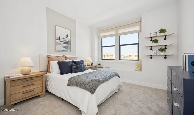 a bedroom with bed and a window