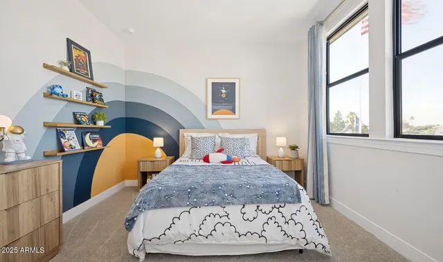 a bedroom with a bed and window