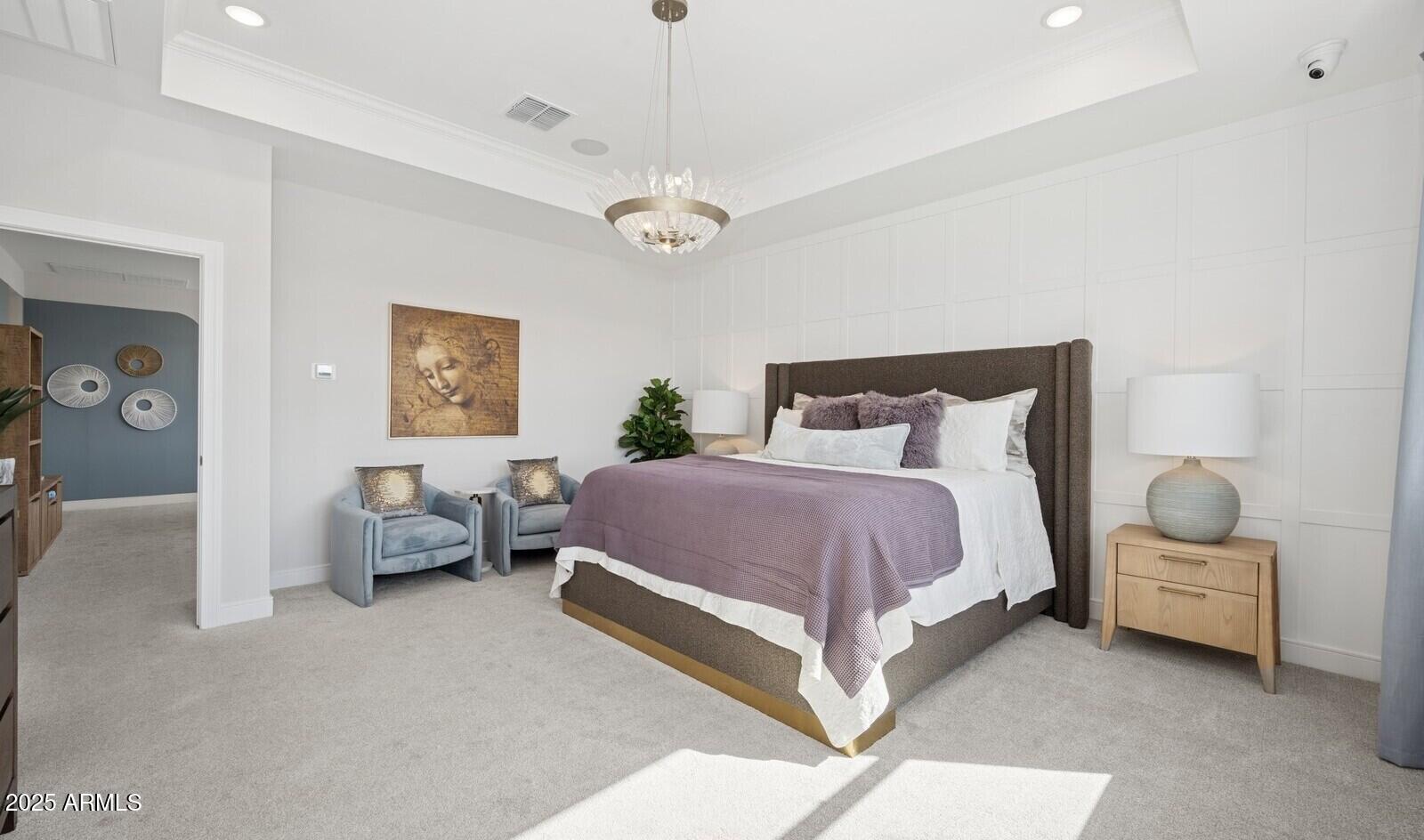 8046 West Royal Palm Road Peoria, AZ 85345 - Photo 28 of 31 a spacious bedroom with a bed and a chandelier
