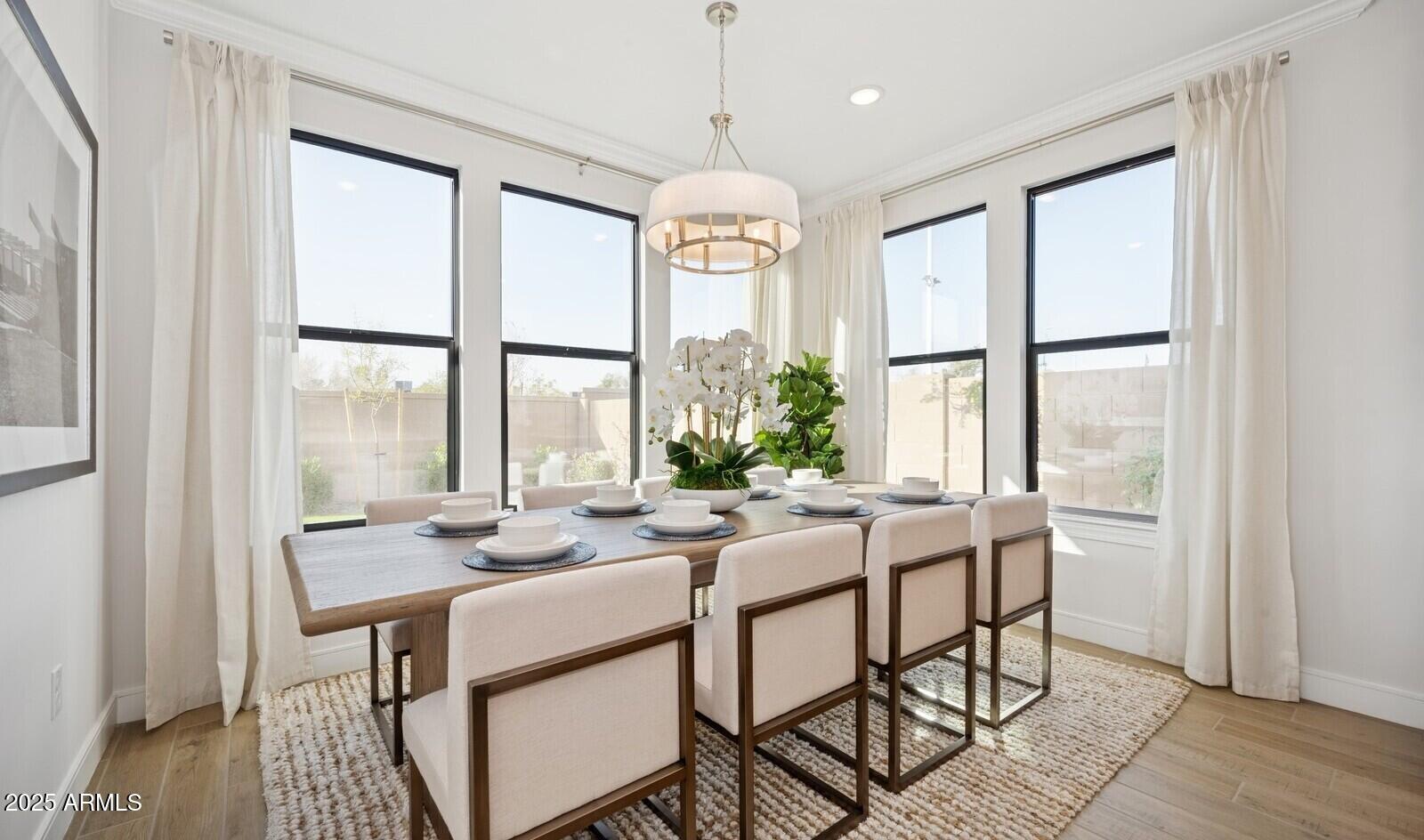 8046 West Royal Palm Road Peoria, AZ 85345 - Photo 3 of 31 a dining room with furniture window wooden floor