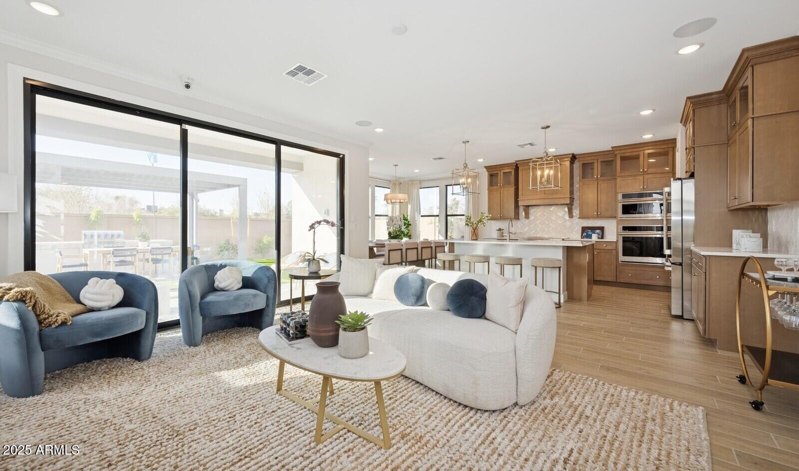 8046 West Royal Palm Road Peoria, AZ 85345 - Photo 4 of 31 a living room with furniture and a large window