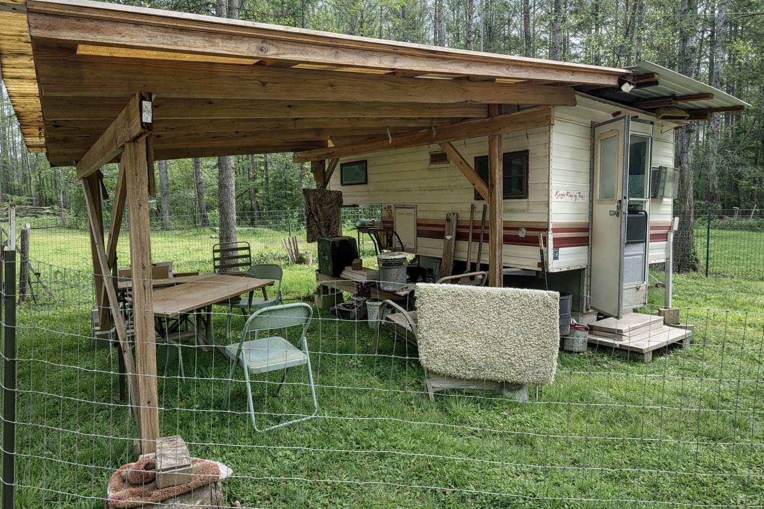2370 Westville Road Groveton, TX 75845 - Photo 11 of 13 a view of backyard with table and chairs and potted plants