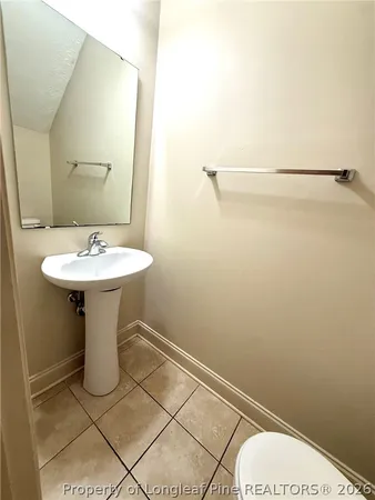 a kitchen with granite countertop a stove a sink and a microwave