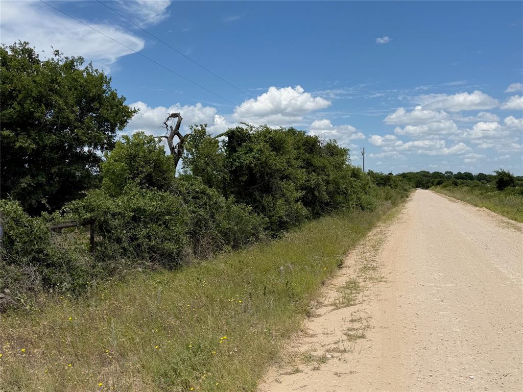 1450 County Road 240 Rising Star, TX 76471 - Photo 2 of 17 a view of a lake with outdoor space