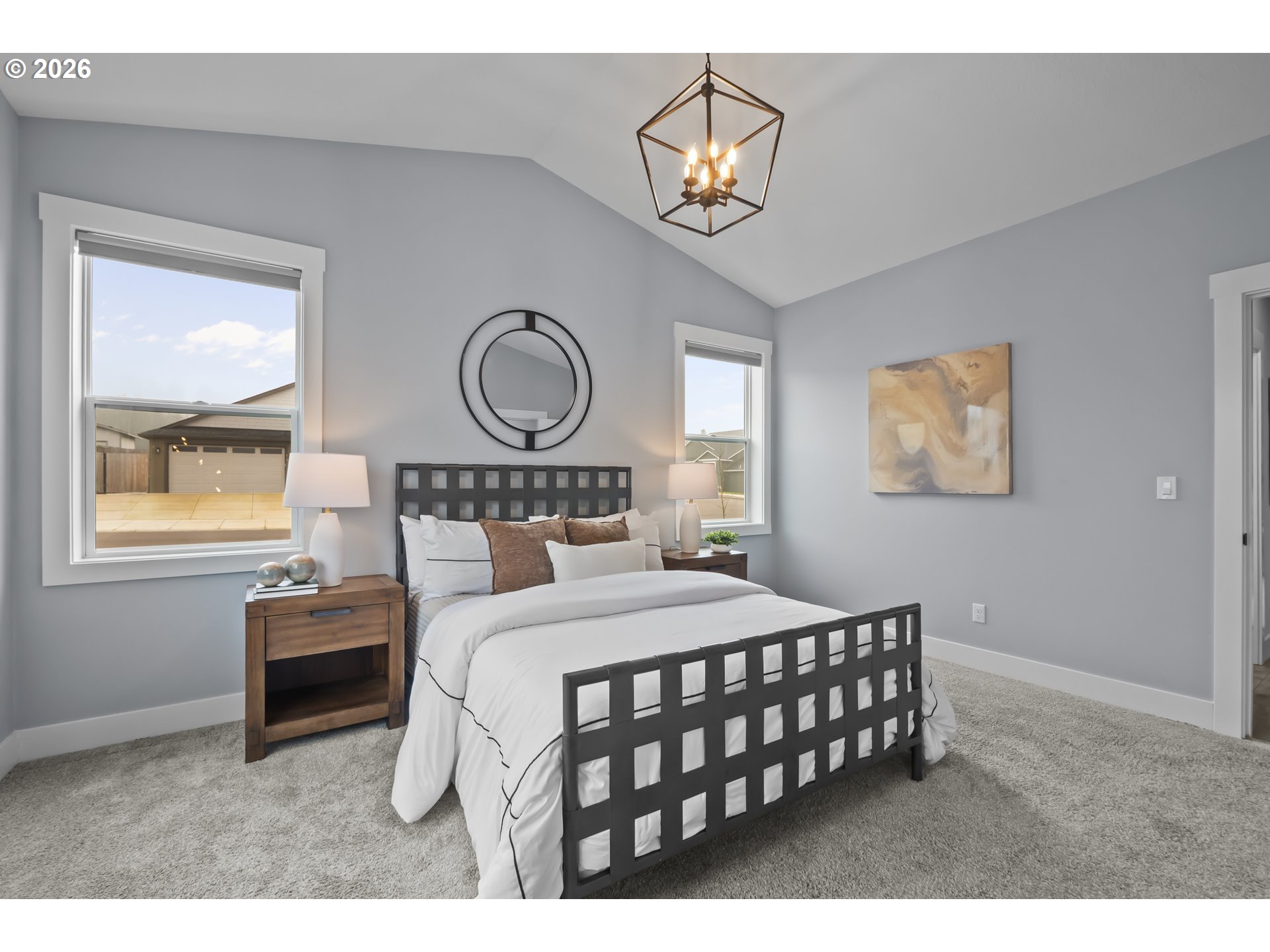 819 Riley Drive Northeast Silverton, OR 97381 - Photo 14 of 38 a bedroom with a bed a chandelier and a window