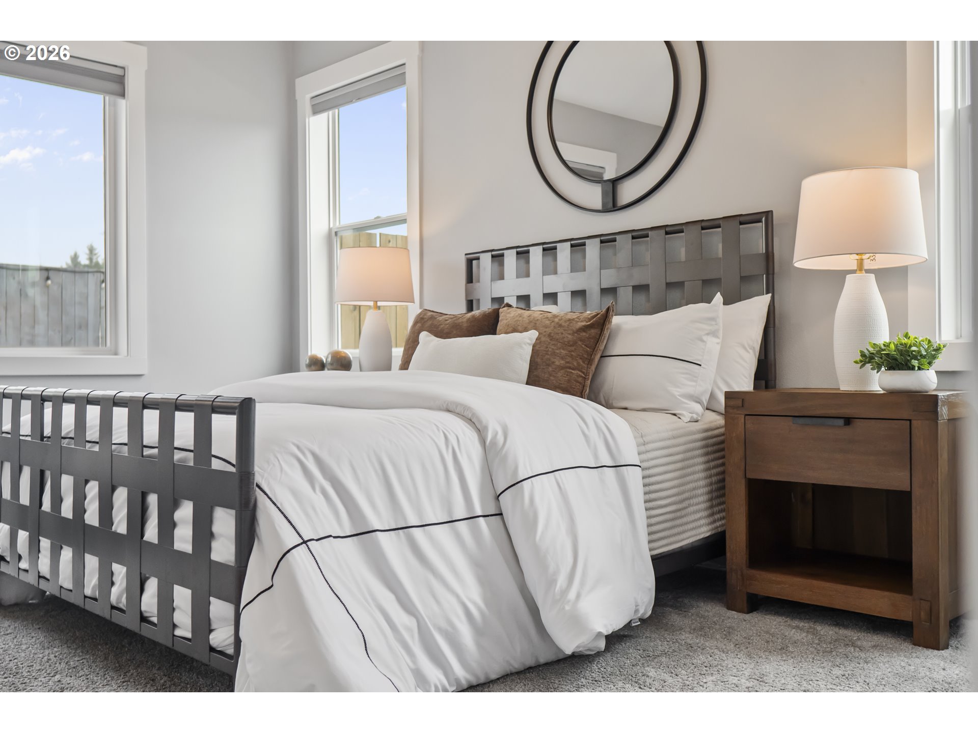 819 Riley Drive Northeast Silverton, OR 97381 - Photo 15 of 38 a bedroom with a bed a mirror and a lamp on dresser